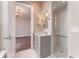 Elegant bathroom featuring a gray vanity with marble countertops and a glass-enclosed shower with subway tile at 3376 Peachtree Ne Rd # 35A, Atlanta, GA 30326