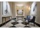 Elegant foyer with black and white marble floors, modern artwork, and stylish seating, creating a sophisticated entrance at 3376 Peachtree Ne Rd # 35A, Atlanta, GA 30326