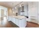 Bright kitchen featuring stainless steel appliances, an island with marble countertops, and modern lighting fixtures at 3376 Peachtree Ne Rd # 35A, Atlanta, GA 30326