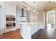 Modern kitchen with stainless steel appliances, marble countertops, a large island, and custom cabinetry at 3376 Peachtree Ne Rd # 35A, Atlanta, GA 30326