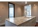 Gourmet kitchen featuring a marble island, stainless steel appliances, and elegant pendant lighting at 3376 Peachtree Ne Rd # 35A, Atlanta, GA 30326