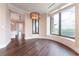Living room featuring hardwood floors, large windows with a view, and access to a gourmet kitchen at 3376 Peachtree Ne Rd # 35A, Atlanta, GA 30326