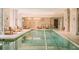 Indoor swimming pool with lounge chairs and neutral color palette at 3376 Peachtree Ne Rd # 35A, Atlanta, GA 30326