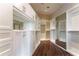Spacious walk-in closet with custom shelving, mirrored doors and ample storage space, offering luxury and organization at 3376 Peachtree Ne Rd # 35A, Atlanta, GA 30326