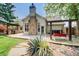 Beautiful backyard with an outdoor kitchen, hot tub, and a swing at 5220 Wild Cedar Dr, Buford, GA 30518