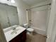 Neutral bathroom with ceramic tile flooring and shower-tub combo at 5220 Wild Cedar Dr, Buford, GA 30518