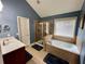 Bathroom featuring a walk-in shower, a separate soaking tub, and a single vanity at 5220 Wild Cedar Dr, Buford, GA 30518