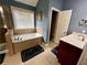 Bathroom featuring a walk-in shower, a separate soaking tub, and a single vanity at 5220 Wild Cedar Dr, Buford, GA 30518