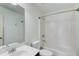 Clean bathroom with white tile and a shower-tub combination, providing a functional space at 5220 Wild Cedar Dr, Buford, GA 30518