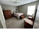 Bedroom with furniture and ample natural light at 5220 Wild Cedar Dr, Buford, GA 30518
