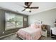 Charming bedroom with cozy, light-colored carpet and ample natural light at 5220 Wild Cedar Dr, Buford, GA 30518