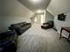 Spacious bonus room offers plenty of seating and a mounted TV at 5220 Wild Cedar Dr, Buford, GA 30518