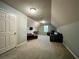 Large bonus room provides versatile space for a media room, playroom, or home office at 5220 Wild Cedar Dr, Buford, GA 30518