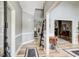Elegant entryway with hardwood floors and trim details at 5220 Wild Cedar Dr, Buford, GA 30518