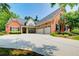 Beautiful brick home featuring an attached garage and well-maintained landscaping at 5220 Wild Cedar Dr, Buford, GA 30518