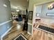 Hallway with wood floors leading to the living room and dining area at 5220 Wild Cedar Dr, Buford, GA 30518