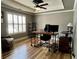 Home office with sleek desk, hardwood floor and natural light at 5220 Wild Cedar Dr, Buford, GA 30518