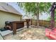 Backyard with wooden fence, a red swing, and a private hot tub at 5220 Wild Cedar Dr, Buford, GA 30518