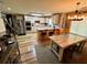 Open kitchen featuring stainless steel appliances, an island with breakfast bar, and an adjacent dining area at 5220 Wild Cedar Dr, Buford, GA 30518