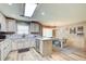 Well-lit kitchen with modern appliances and a cozy dining area at 5220 Wild Cedar Dr, Buford, GA 30518