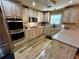 Well-appointed kitchen with stainless steel appliances and ample counter space at 5220 Wild Cedar Dr, Buford, GA 30518
