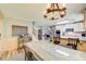 Spacious kitchen and eat-in dining area featuring wood floors, a center island, and pendant lighting at 5220 Wild Cedar Dr, Buford, GA 30518