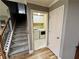 Convenient laundry room with modern appliances, storage cabinets, and easy access from the staircase at 5220 Wild Cedar Dr, Buford, GA 30518