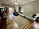 Spacious living room with fireplace, plush seating, and natural light at 5220 Wild Cedar Dr, Buford, GA 30518