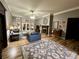 Open living room with fireplace, neutral tones, and access to the backyard at 5220 Wild Cedar Dr, Buford, GA 30518