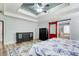 Large main bedroom offers a decorative ceiling, rug, and access to the main bathroom at 5220 Wild Cedar Dr, Buford, GA 30518