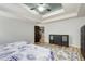 The main bedroom has wood floors, a patterned rug, and a decorative ceiling at 5220 Wild Cedar Dr, Buford, GA 30518