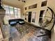 Sunroom with outdoor seating, fireplace and swing at 5220 Wild Cedar Dr, Buford, GA 30518