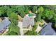 The aerial view shows a home surrounded by mature trees, offering a sense of privacy at 7920 Tintern Trce, Duluth, GA 30097