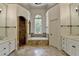 Spacious bathroom with separate vanities, a soaking tub, and tiled walk-in shower at 7920 Tintern Trce, Duluth, GA 30097