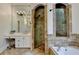Bright bathroom with vanity, tiled shower, tile flooring, bathtub, and marble countertops at 7920 Tintern Trce, Duluth, GA 30097