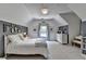Bright bedroom with a vaulted ceiling, neutral decor, and a window allowing natural light at 7920 Tintern Trce, Duluth, GA 30097