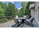 Backyard deck features comfortable seating and a barbecue grill for entertaining at 7920 Tintern Trce, Duluth, GA 30097