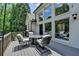 Spacious deck with outdoor seating and view of the backyard at 7920 Tintern Trce, Duluth, GA 30097