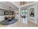 Open concept foyer with dining area, archways, and views into the living room at 7920 Tintern Trce, Duluth, GA 30097