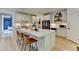 Open kitchen with a large center island and stainless steel appliances at 7920 Tintern Trce, Duluth, GA 30097