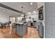 Open kitchen with island, pendant lighting, and ample cabinet space at 7920 Tintern Trce, Duluth, GA 30097