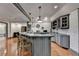 Stylish kitchen bar area with pendant lights, seating, and modern appliances at 7920 Tintern Trce, Duluth, GA 30097