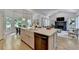 Spacious island kitchen with hardwood floors and an open floor plan at 7920 Tintern Trce, Duluth, GA 30097