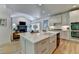 Island kitchen featuring a farmhouse sink and stainless steel appliances at 7920 Tintern Trce, Duluth, GA 30097