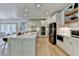 Bright, open kitchen with large island, stainless appliances, and wood accents at 7920 Tintern Trce, Duluth, GA 30097