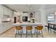 Spacious kitchen features a large island with seating and wood floors at 7920 Tintern Trce, Duluth, GA 30097