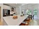 Large kitchen island with seating, stainless steel appliances, and hardwood floors at 7920 Tintern Trce, Duluth, GA 30097