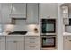 Well-equipped kitchen featuring stainless steel appliances and white cabinetry at 7920 Tintern Trce, Duluth, GA 30097