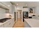 Modern kitchen features quartz countertops, stainless steel appliances and wood floors at 7920 Tintern Trce, Duluth, GA 30097