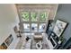 Bright living room with fireplace and natural light overlooking the deck at 7920 Tintern Trce, Duluth, GA 30097